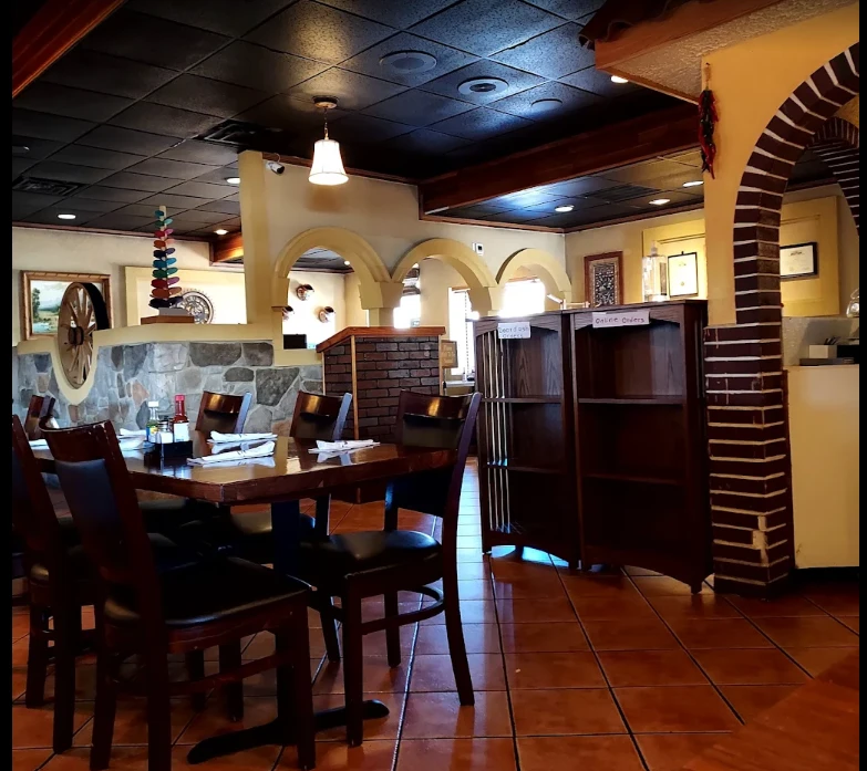 Cazadores Milford dining room with arches and wood tables